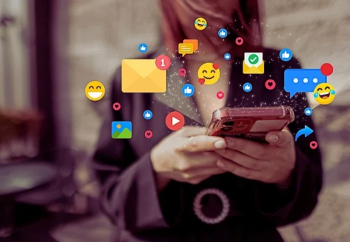 a young woman in a blazer holding a smartphone with both hands. Social Media Can Impact High-Asset Divorce