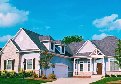 A one-story residential home with a combination of vinyl siding and stone exterior. Dividing Multiple Real Estate Properties