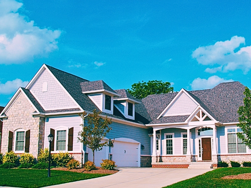 A one-story residential home with a combination of vinyl siding and stone exterior. Dividing Multiple Real Estate Properties