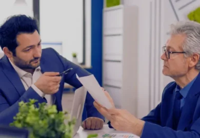 A lawyer assisting his client who is reviewing legal documents in the office professional practice considered marital property