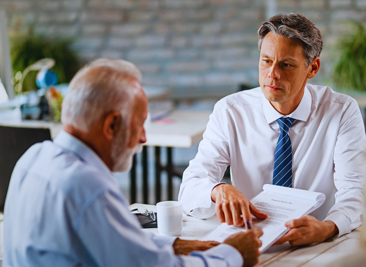 older man with grey hair and beard talking to a Northbrook High Asset Divorce Lawyer